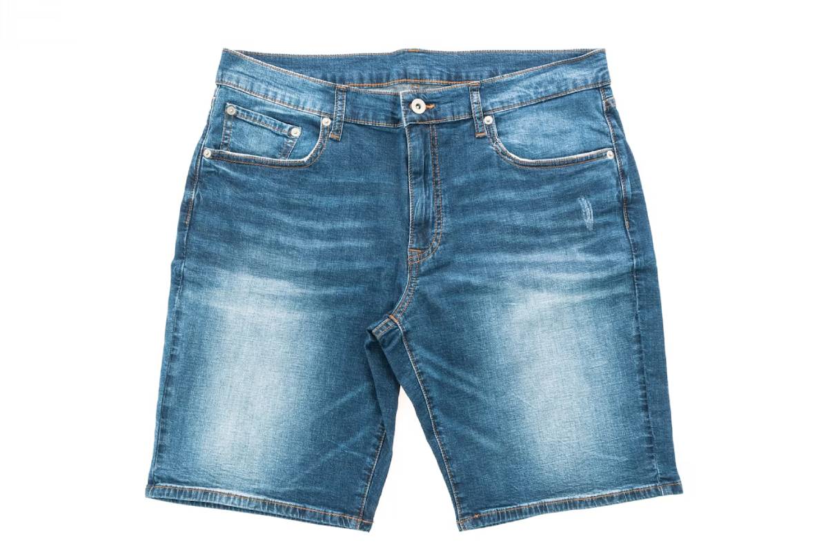 Light blue denim shorts with a faded finish, featuring four pockets and a front button closure.
